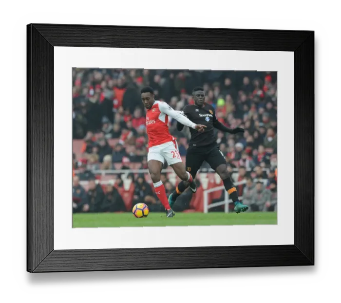 Framed Print : Arsenal vs Hull City: Welbeck Takes on Diaye in Intense Premier League Clash