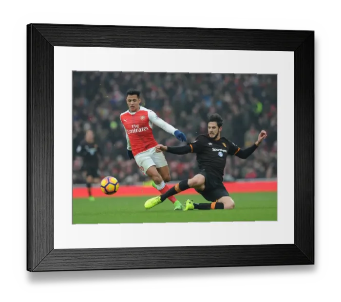 Framed Print : Arsenal's Alexis Sanchez Faces Off Against Hull City's Andrea Ranocchia in Premier League Clash Framed Print : Arsenal's Alexis Sanchez Faces Off Against Hull City's Andrea Ranocchia in Premier League Clash