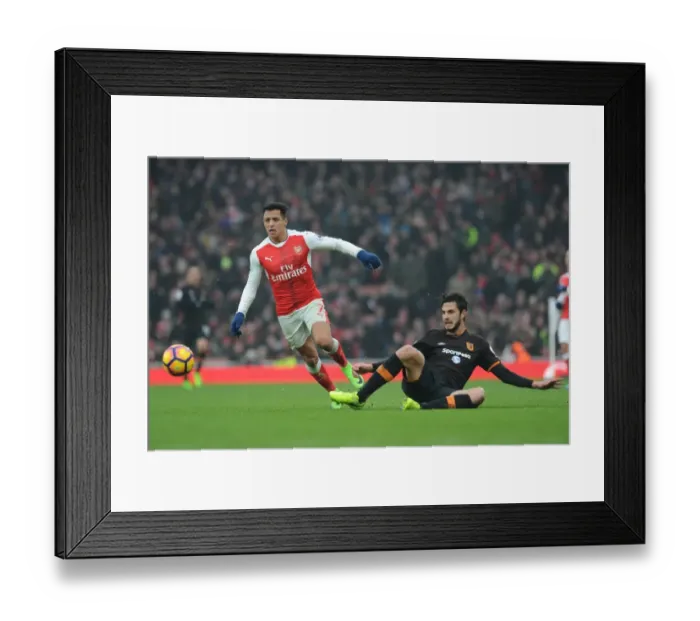 Framed Print : Arsenal's Alexis Sanchez vs. Hull City's Andrea Ranocchia: A Premier League Showdown at Emirates Stadium