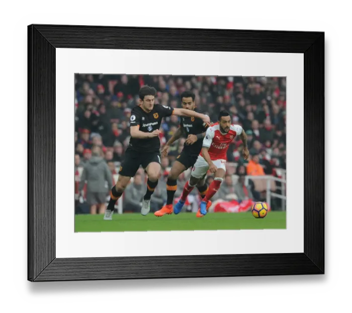 Framed Print : Arsenal's Theo Walcott Faces Off Against Hull's Maguire and Huddlestone in Intense Premier League Clash