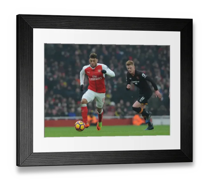 Framed Print : Arsenal's Oxlade-Chamberlain Faces Off Against Hull's Clucas in Premier League Clash Framed Print : Arsenal's Oxlade-Chamberlain Faces Off Against Hull's Clucas in Premier League Clash