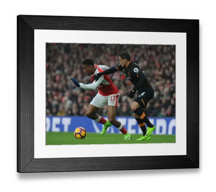 Framed Print : Arsenal's Alex Iwobi Clashes with Hull's Omar Elabdellaoui in Premier League Showdown