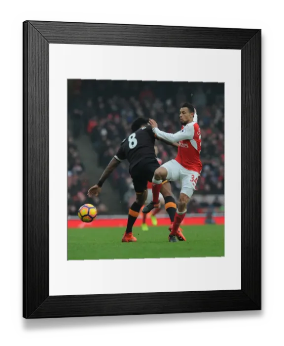 Framed Print : Coquelin vs Huddlestone: A Premier League Battle at Emirates Stadium Framed Print : Coquelin vs Huddlestone: A Premier League Battle at Emirates Stadium