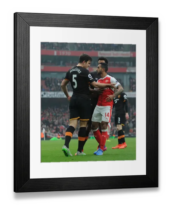 Framed Print : Arsenal vs Hull City: Walcott vs Maguire - A Fierce On-Field Showdown