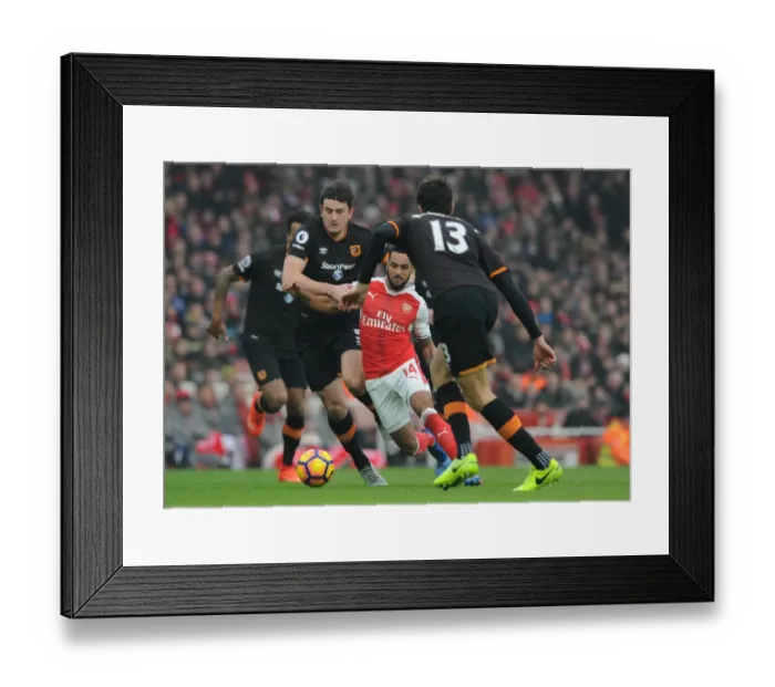 Framed Print : Theo Walcott's Intense Showdown Against Hull City's Defense in the Premier League Framed Print : Theo Walcott's Intense Showdown Against Hull City's Defense in the Premier League