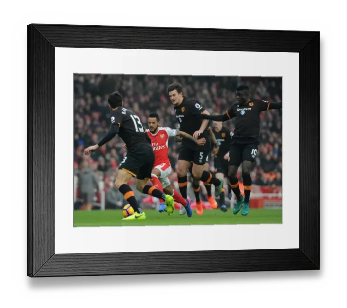 Framed Print : Arsenal's Theo Walcott Clashes with Hull Defenders during Premier League Match Framed Print : Arsenal's Theo Walcott Clashes with Hull Defenders during Premier League Match