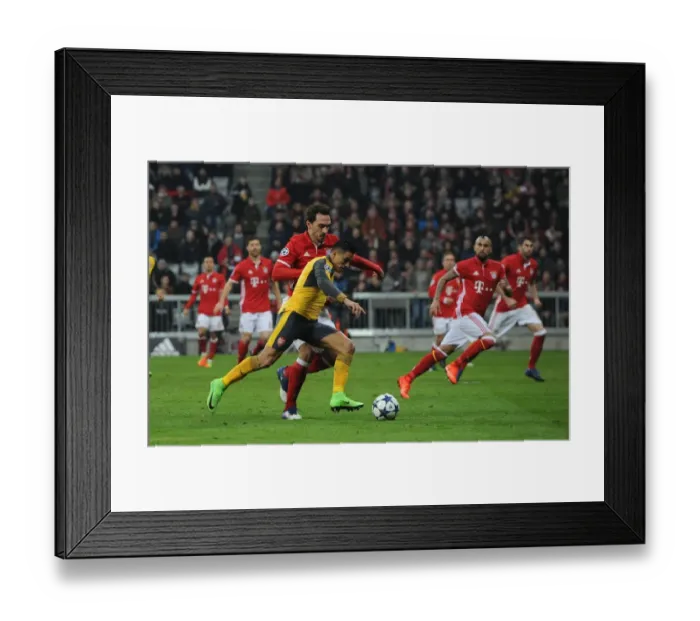 Framed Print : Alexis Sanchez vs. Mats Hummels: Battle in the UEFA Champions League - Arsenal vs. Bayern Munich (2016-17)