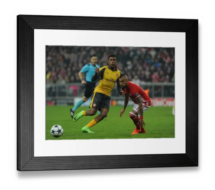 Framed Print : Arsenal's Alex Iwobi Battles Arturo Vidal in UEFA Champions League Showdown: Bayern Munich vs. Arsenal (2016-17) Framed Print : Arsenal's Alex Iwobi Battles Arturo Vidal in UEFA Champions League Showdown: Bayern Munich vs. Arsenal (2016-17)