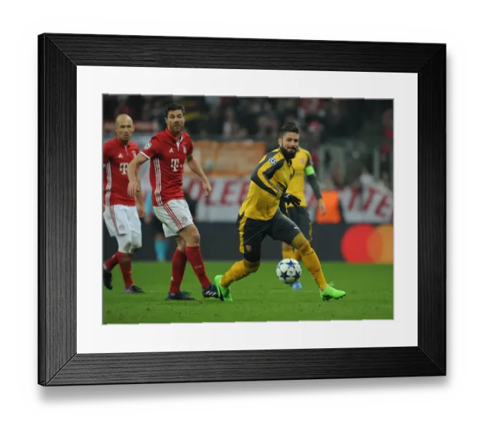 Framed Print : Olivier Giroud Breaks Past Xabi Alonso: Arsenal vs. Bayern Munich, UEFA Champions League Round of 16 - First Leg Framed Print : Olivier Giroud Breaks Past Xabi Alonso: Arsenal vs. Bayern Munich, UEFA Champions League Round of 16 - First Leg