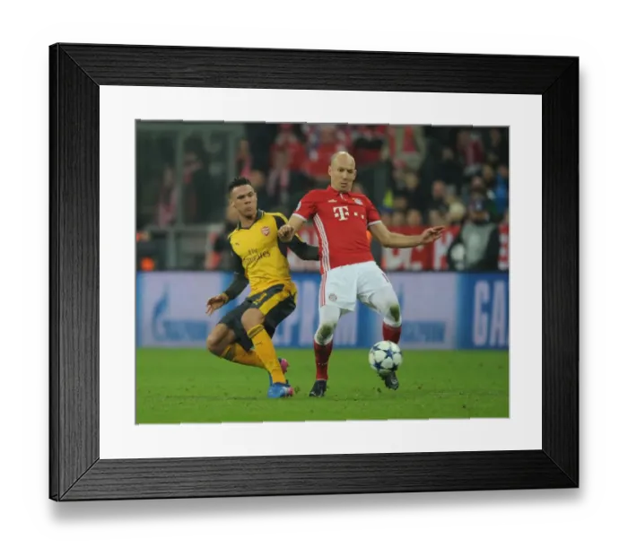 Framed Print : Arsenal's Kieran Gibbs Faces Off Against Bayern Munchen's Arjen Robben in Champions League Clash Framed Print : Arsenal's Kieran Gibbs Faces Off Against Bayern Munchen's Arjen Robben in Champions League Clash