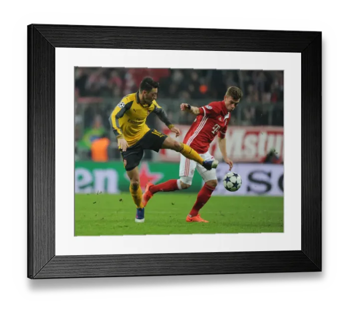Framed Print : Mesut Ozil vs Joshua Kimmich: Battle in the UEFA Champions League - Bayern Munich vs Arsenal