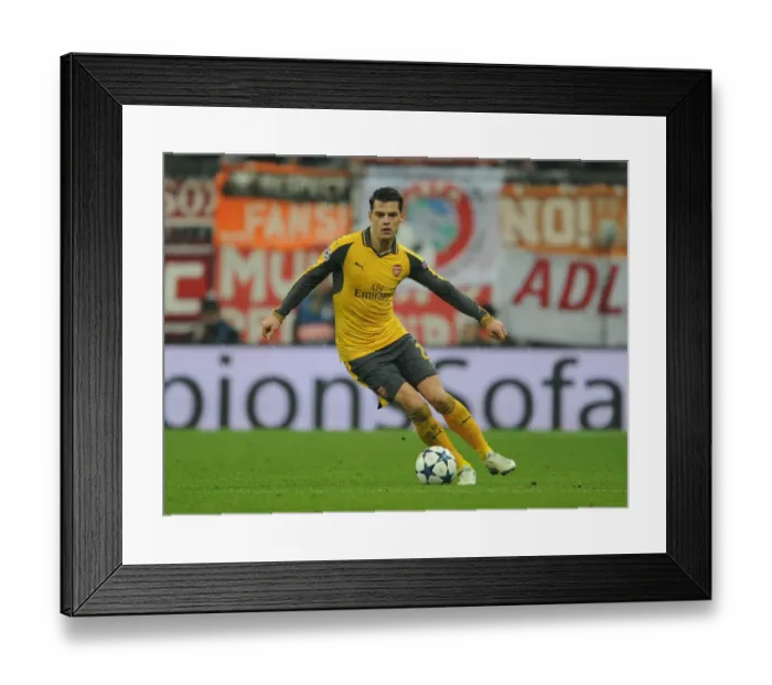 Framed Print : Granit Xhaka: Arsenal's Midfield Maestro in Bayern Munich Showdown, UEFA Champions League 2016-17