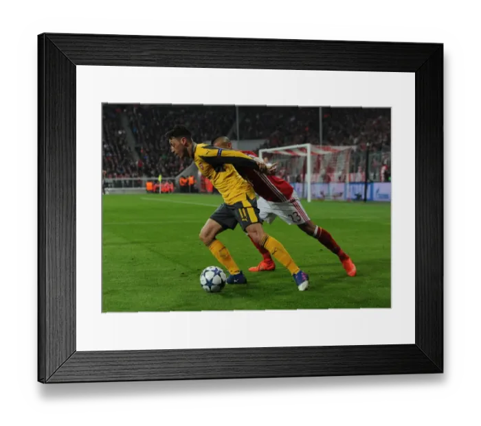 Framed Print : Mesut Ozil vs. Arturo Vidal: Bayern Munich Crushes Arsenal 5-1 in UEFA Champions League Round of 16 (First Leg) Framed Print : Mesut Ozil vs. Arturo Vidal: Bayern Munich Crushes Arsenal 5-1 in UEFA Champions League Round of 16 (First Leg)