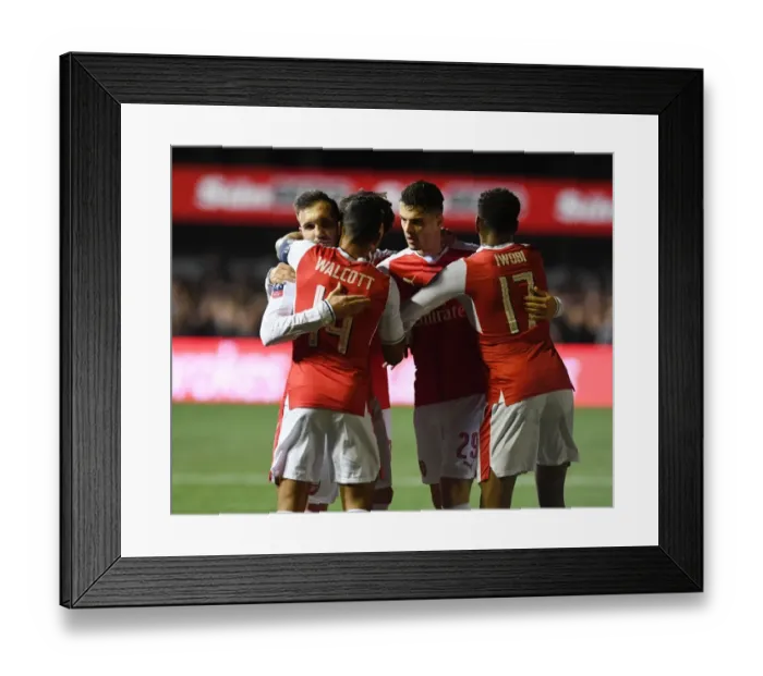 Framed Print : Arsenal's Upset Victory over Sutton United in FA Cup: Perez, Walcott, Xhaka, and Iwobi Celebrate Framed Print : Arsenal's Upset Victory over Sutton United in FA Cup: Perez, Walcott, Xhaka, and Iwobi Celebrate