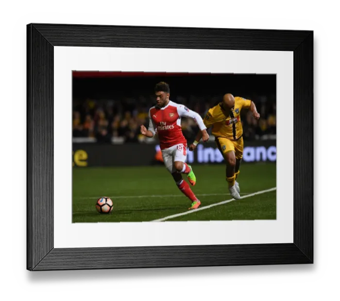 Framed Print : Arsenal's Oxlade-Chamberlain Overpowers Sutton United in FA Cup Fifth Round