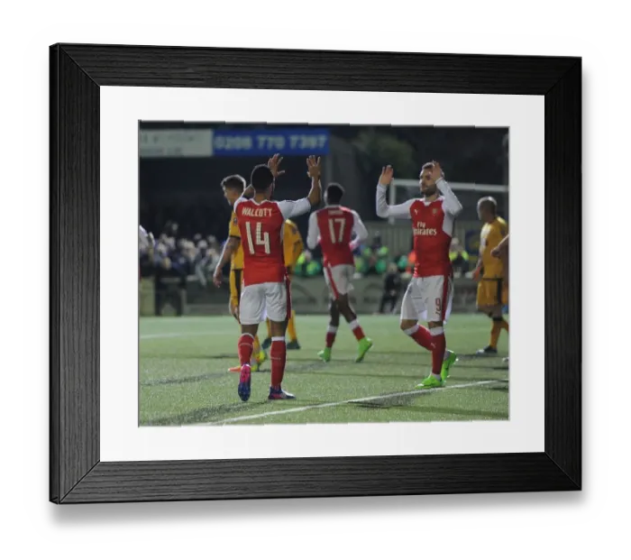 Framed Print : Theo Walcott's Brace: Arsenal's Emirates FA Cup Victory over Sutton United