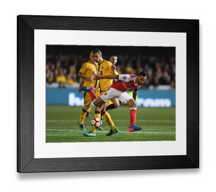 Framed Print : Theo Walcott Dodges Past Craig Eastmond: Sutton United vs. Arsenal in The Emirates FA Cup Fifth Round