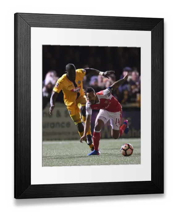 Framed Print : Theo Walcott vs. Kevin Amankwaah: A FA Cup Battle at Sutton United
