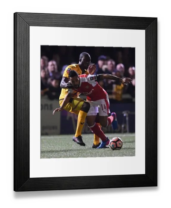 Framed Print : Theo Walcott vs. Kevin Amankwaah: A FA Cup Battle at Sutton United (2017) Framed Print : Theo Walcott vs. Kevin Amankwaah: A FA Cup Battle at Sutton United (2017)