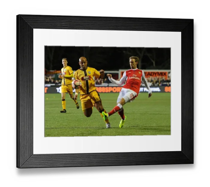 Framed Print : Arsenal's Nacho Monreal Faces Off Against Sutton United's Simon Downer in FA Cup Fifth Round Clash