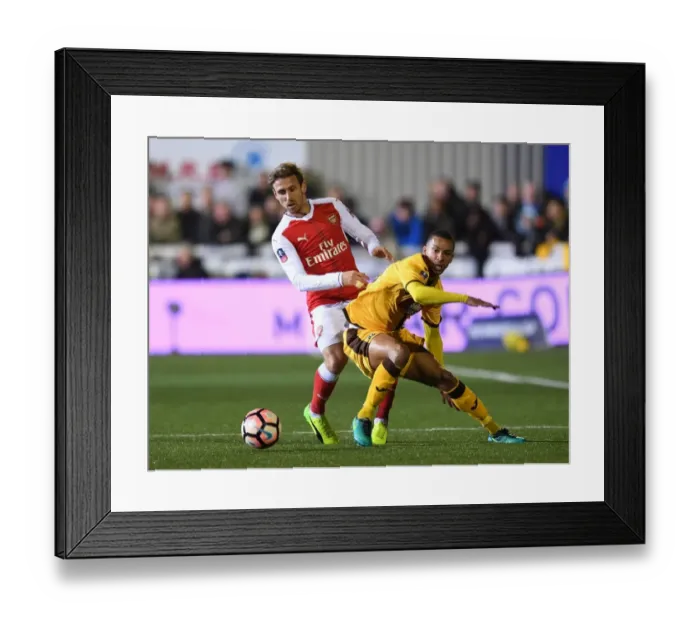 Framed Print : Nacho Monreal vs Craig Eastmond: The FA Cup Fifth Round Battle - Sutton United vs Arsenal Framed Print : Nacho Monreal vs Craig Eastmond: The FA Cup Fifth Round Battle - Sutton United vs Arsenal