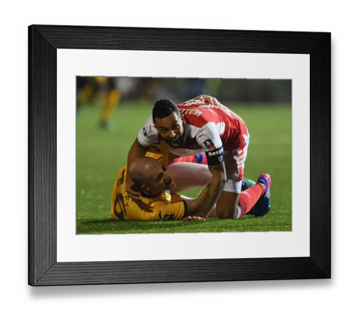 Framed Print : Theo Walcott's Dramatic Fall: Sutton United vs. Arsenal in The Emirates FA Cup