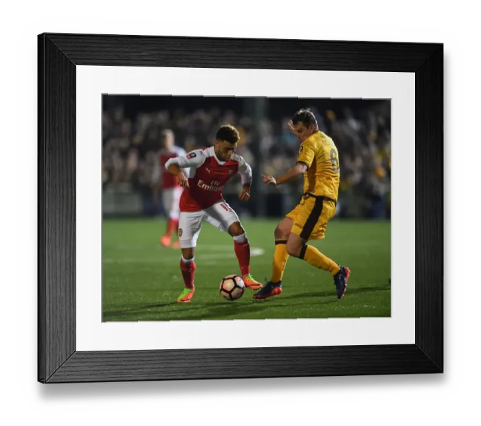 Framed Print : Arsenal's Oxlade-Chamberlain vs Collins: A FA Cup Fifth Round Battle Framed Print : Arsenal's Oxlade-Chamberlain vs Collins: A FA Cup Fifth Round Battle