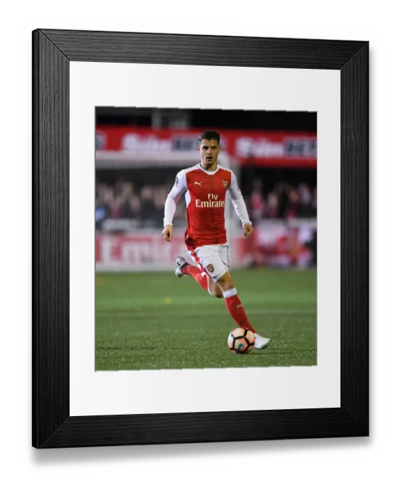 Framed Print : Granit Xhaka Leads Arsenal in FA Cup Battle against Sutton United