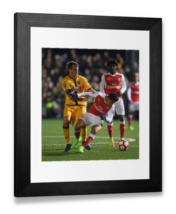 Framed Print : Sanchez vs. Collins: Arsenal's FA Cup Fifth Round Battle at Sutton United Framed Print : Sanchez vs. Collins: Arsenal's FA Cup Fifth Round Battle at Sutton United
