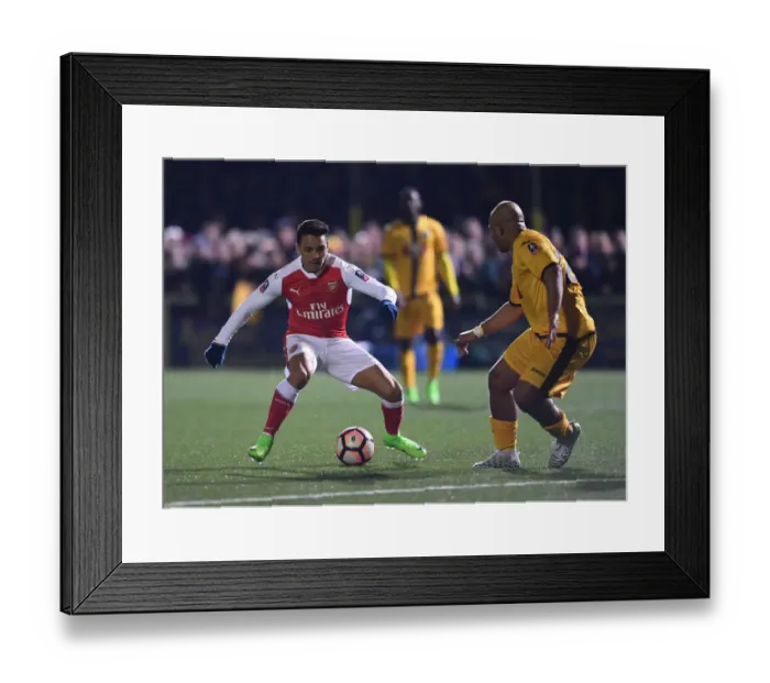 Framed Print : Alexis Sanchez vs. Simon Downer: A FA Cup Fifth Round Battle - Sutton United's Surprising Showdown with Arsenal Framed Print : Alexis Sanchez vs. Simon Downer: A FA Cup Fifth Round Battle - Sutton United's Surprising Showdown with Arsenal