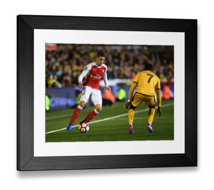 Framed Print : Sutton United vs. Arsenal: The FA Cup Fifth Round Clash - Gabriel vs. Hudson-Odoi Framed Print : Sutton United vs. Arsenal: The FA Cup Fifth Round Clash - Gabriel vs. Hudson-Odoi
