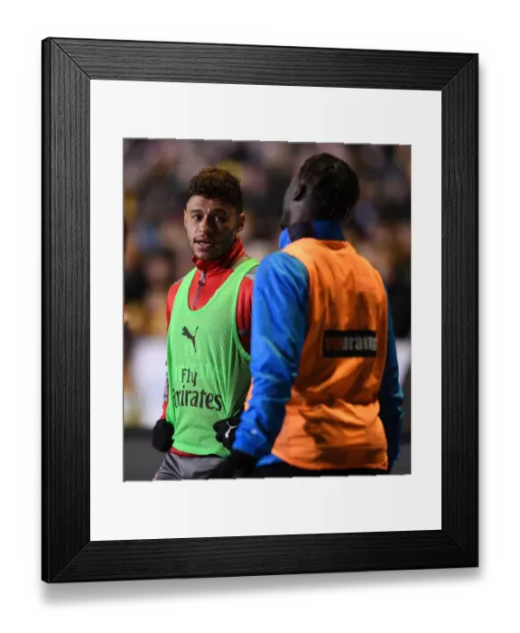 Framed Print : Pre-Match Chat: Oxlade-Chamberlain and Monakana of Sutton United and Arsenal Framed Print : Pre-Match Chat: Oxlade-Chamberlain and Monakana of Sutton United and Arsenal