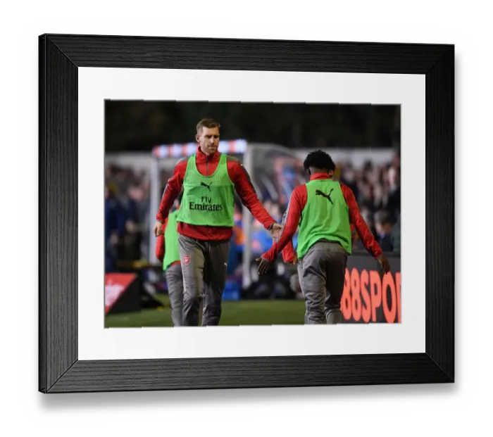 Framed Print : Arsenal's Unforgettable FA Cup Encounter: Per Mertesacker and Ainsley Maitland-Niles High-Five at Sutton United Framed Print : Arsenal's Unforgettable FA Cup Encounter: Per Mertesacker and Ainsley Maitland-Niles High-Five at Sutton United