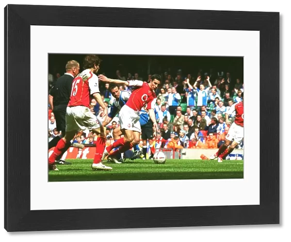 Robin van Persie (Arsenal) turns Lucas Neill (Rovers) on his way to scoring Arsenals 2nd goal h
