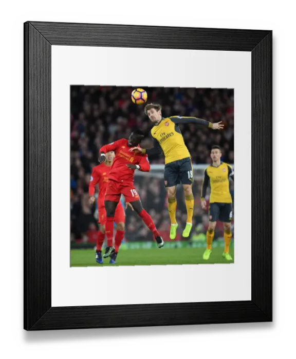 Framed Print : Nacho Monreal Leaps Ahead: Liverpool vs. Arsenal, Premier League 2016-17