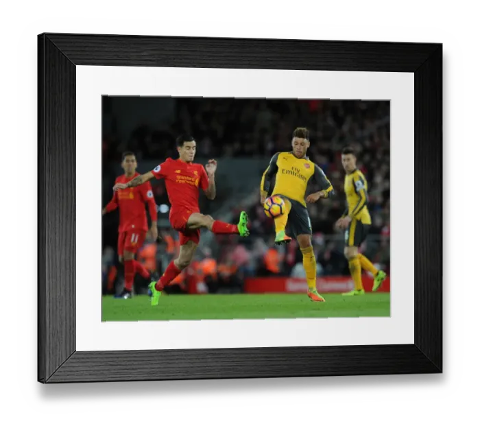 Framed Print : Clash of the Stars: Oxlade-Chamberlain vs. Coutinho - Liverpool vs. Arsenal Rivalry: A Battle at Anfield
