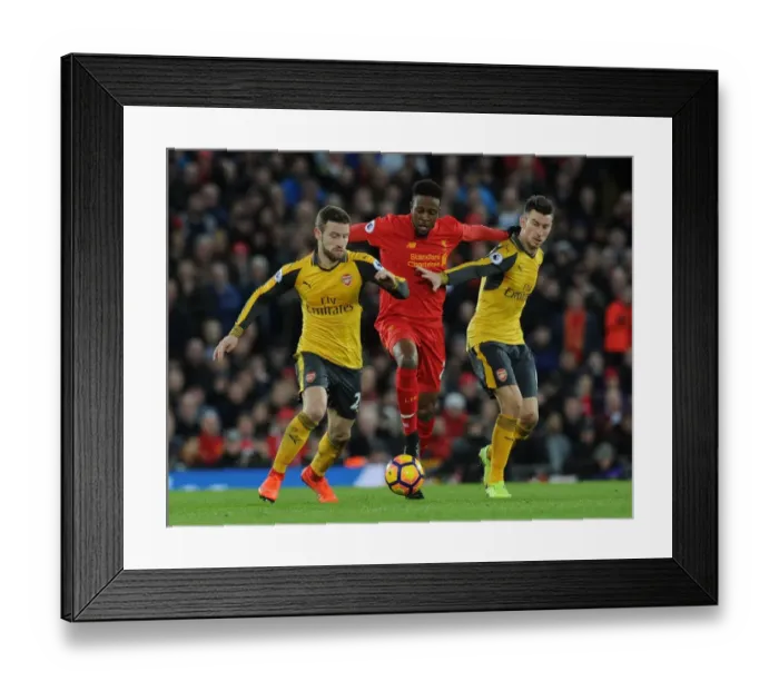 Framed Print : Arsenal Defenders Mustafi and Koscielny Closing In on Liverpool's Origi in Intense Premier League Clash (2016-17) Framed Print : Arsenal Defenders Mustafi and Koscielny Closing In on Liverpool's Origi in Intense Premier League Clash (2016-17)