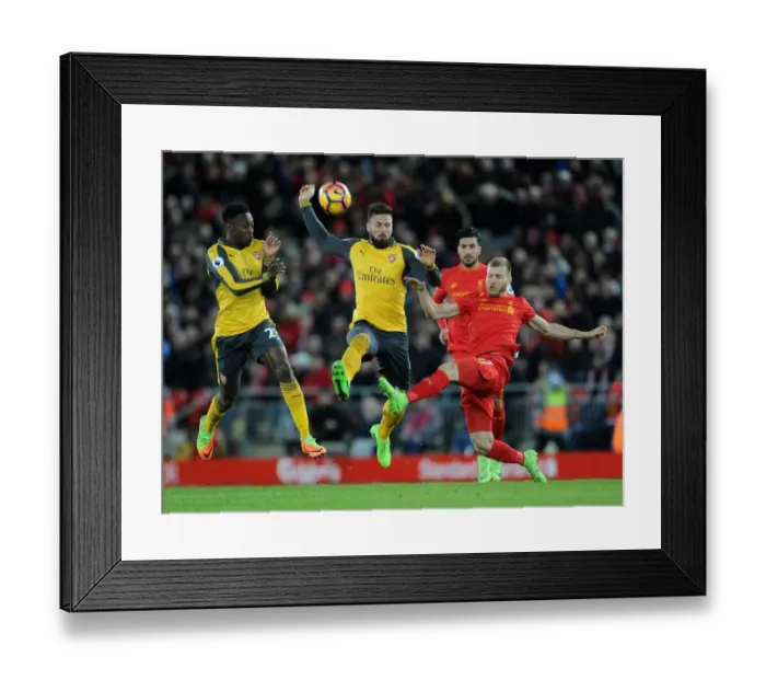 Framed Print : Clash at Anfield: Arsenal's Welbeck and Giroud Pressure Liverpool's Klavan (Premier League 2016-17)