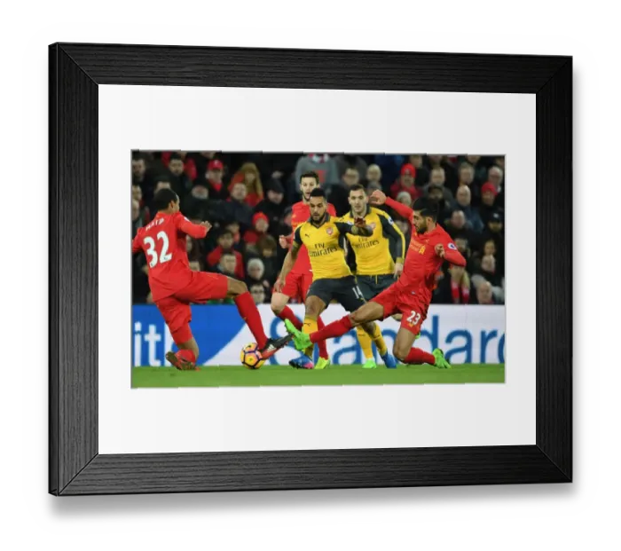 Framed Print : Intense Battle: Walcott vs. Liverpool's Defense - Walcott Takes on Matip and Can at Anfield, Premier League 2016-17