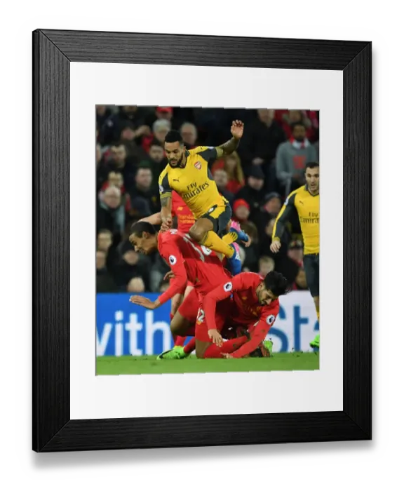 Framed Print : Clash at Anfield: Walcott's Intense Battle Against Matip and Can