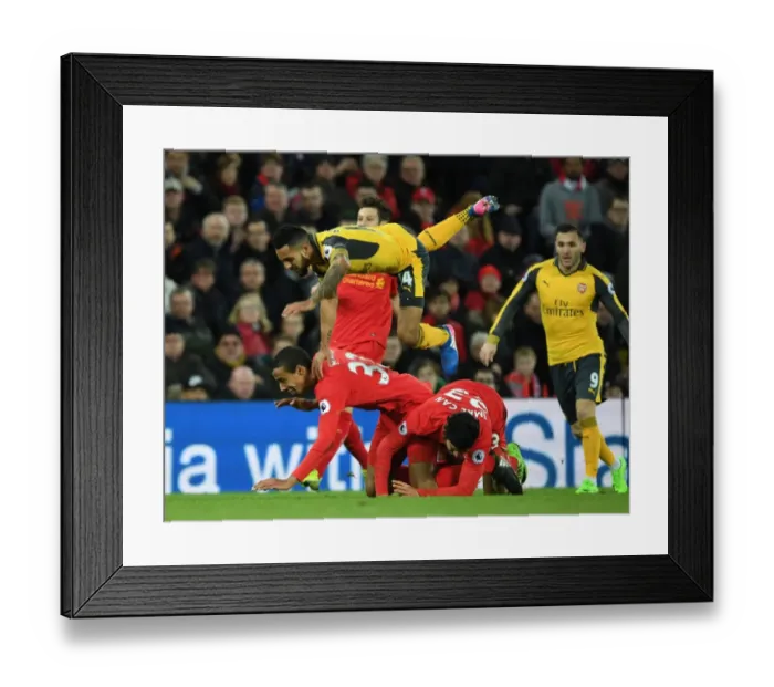 Framed Print : Theo Walcott Faces Off Against Matip and Can in Intense Liverpool vs. Arsenal Premier League Clash Framed Print : Theo Walcott Faces Off Against Matip and Can in Intense Liverpool vs. Arsenal Premier League Clash