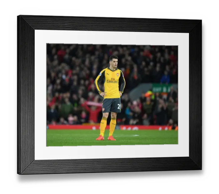 Framed Print : Granit Xhaka: Intense Battle at Anfield - Liverpool vs. Arsenal, Premier League 2016-17
