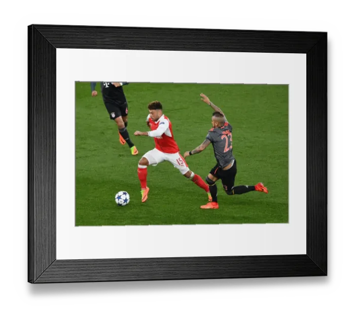Framed Print : Champions League Showdown: Oxlade-Chamberlain vs. Vidal at Emirates Stadium
