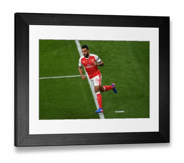 Framed Print : Theo Walcott's Goal: Arsenal's Victory Moment Against Bayern Munich in the Champions League
