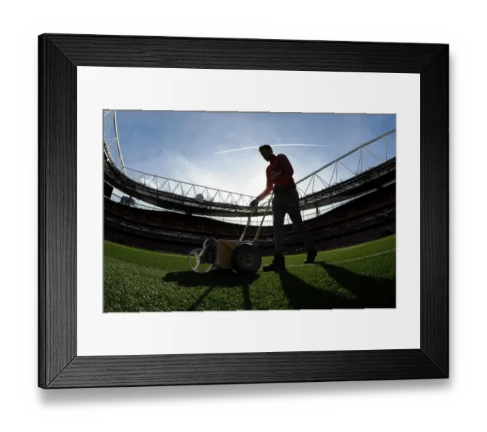 Framed Print : Preparing the Emirates Turf: Arsenal FC vs. FC Bayern Munich - UEFA Champions League Showdown