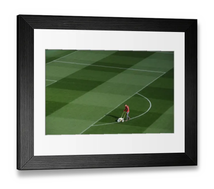 Framed Print : Preparing the Emirates Turf: Arsenal FC vs. FC Bayern Munich - UEFA Champions League Showdown
