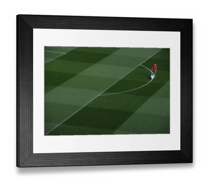 Framed Print : Preparing the Emirates Turf: Arsenal FC Readies for Champions League Showdown against FC Bayern Munich
