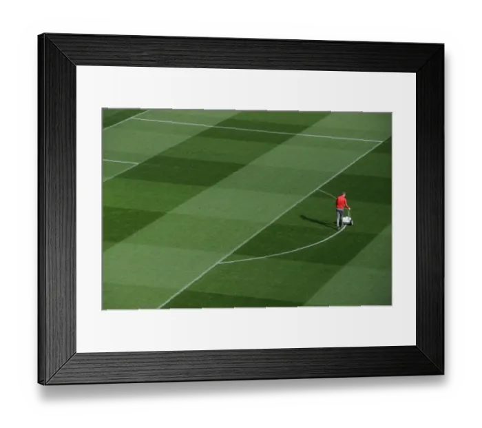 Framed Print : Arsenal Groundsman Prepares Emirates Turf for Arsenal vs. Bayern Munich Champions League Clash Framed Print : Arsenal Groundsman Prepares Emirates Turf for Arsenal vs. Bayern Munich Champions League Clash