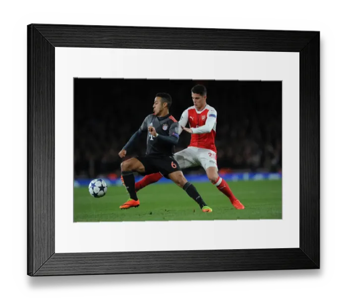 Framed Print : Clash of Midfield Titans: Xhaka vs. Thiago in Arsenal vs. Bayern Munich Champions League Showdown Framed Print : Clash of Midfield Titans: Xhaka vs. Thiago in Arsenal vs. Bayern Munich Champions League Showdown