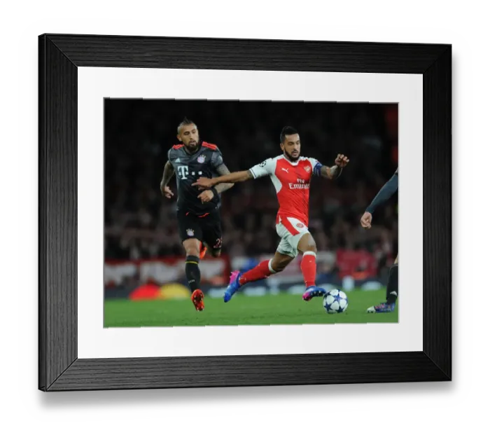 Framed Print : Arsenal vs. Bayern Munich Showdown: Walcott vs. Vidal in UEFA Champions League Battle